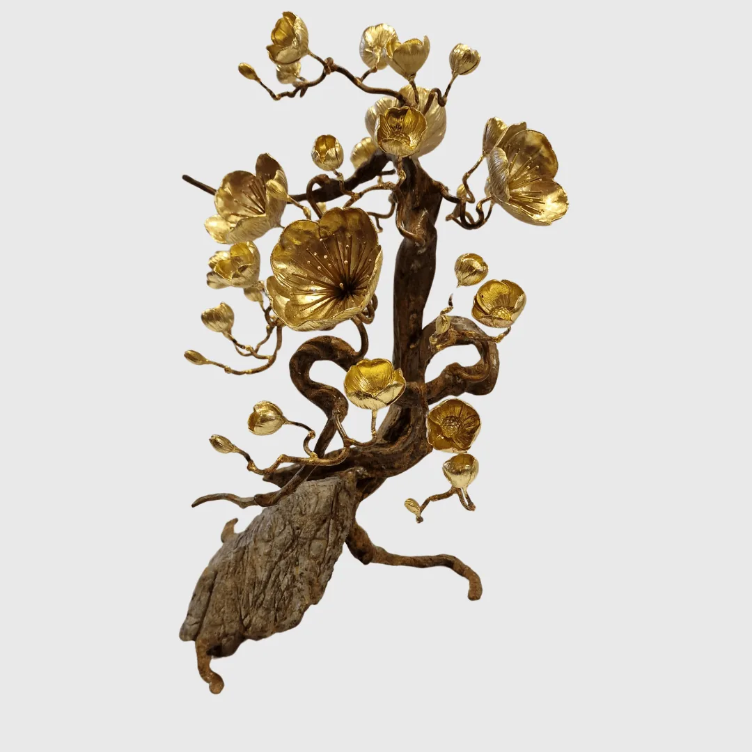 Bronze Blossom ON ROCK Sculpture — The bronze finish enhances the sculptural details, giving the flower a rich, luminous…