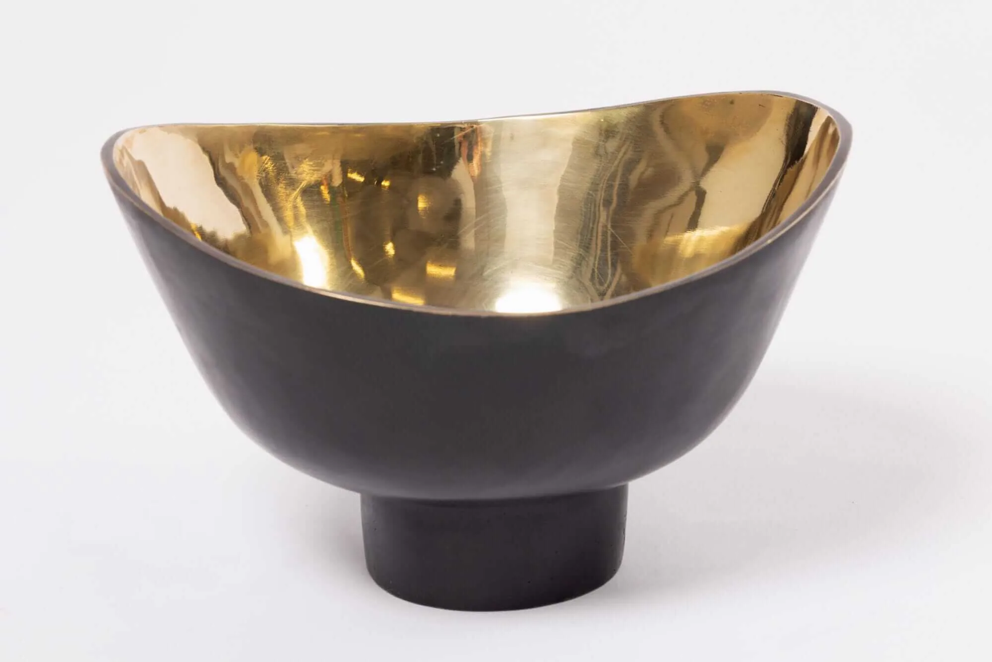 Bronze Curve Bowl — Bronze, with its bold timeless appeal, has a strength that is perceptible visually and to the touch.