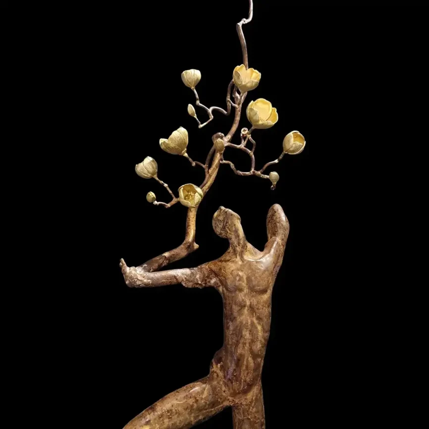 Bronze Wall Figure With Blossom — bronze sculpture
