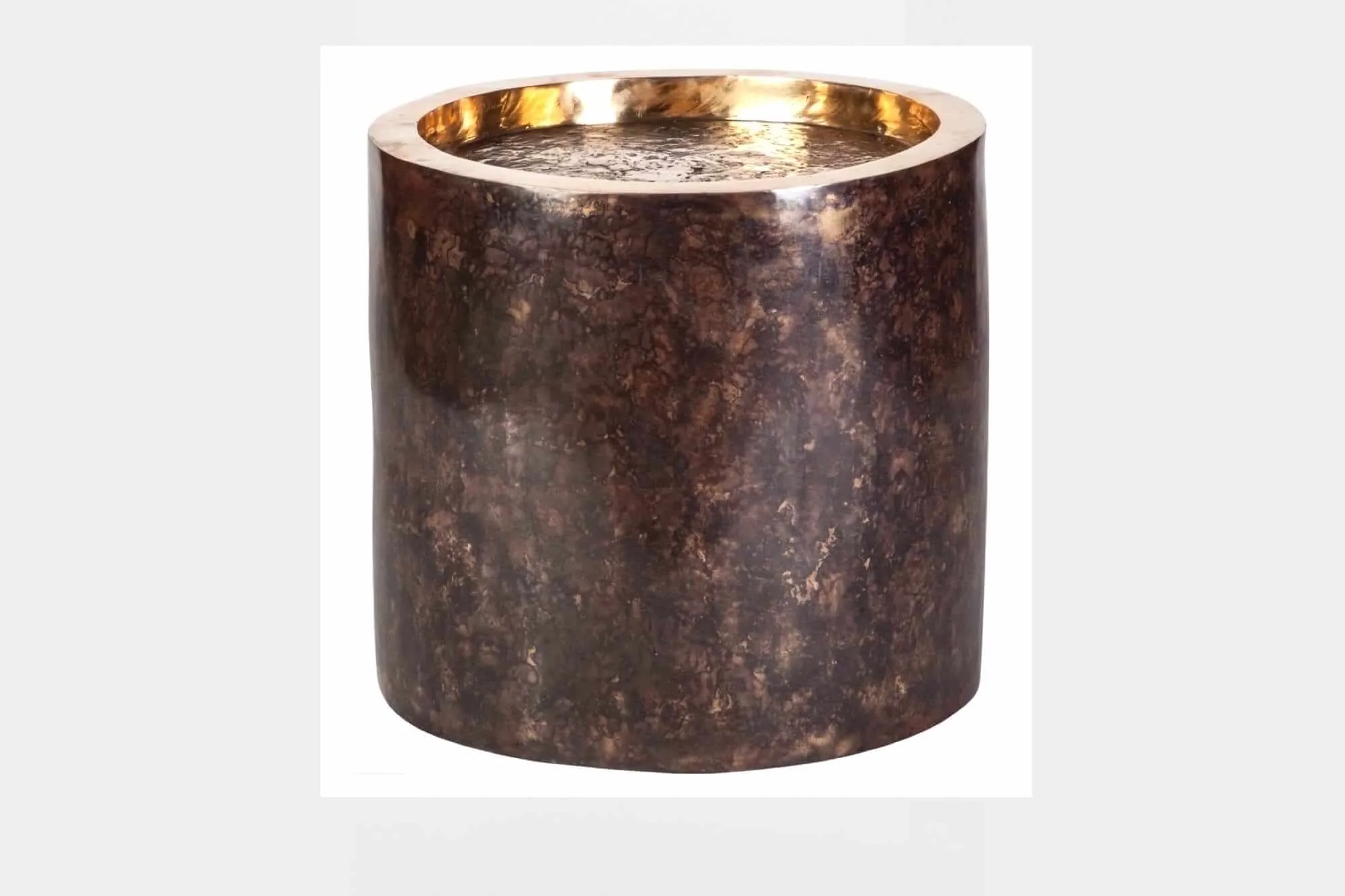 Crater Bronze Table — Each piece begins as a hand-sculpted wax model, carefully encased in clay and heated until the wax…