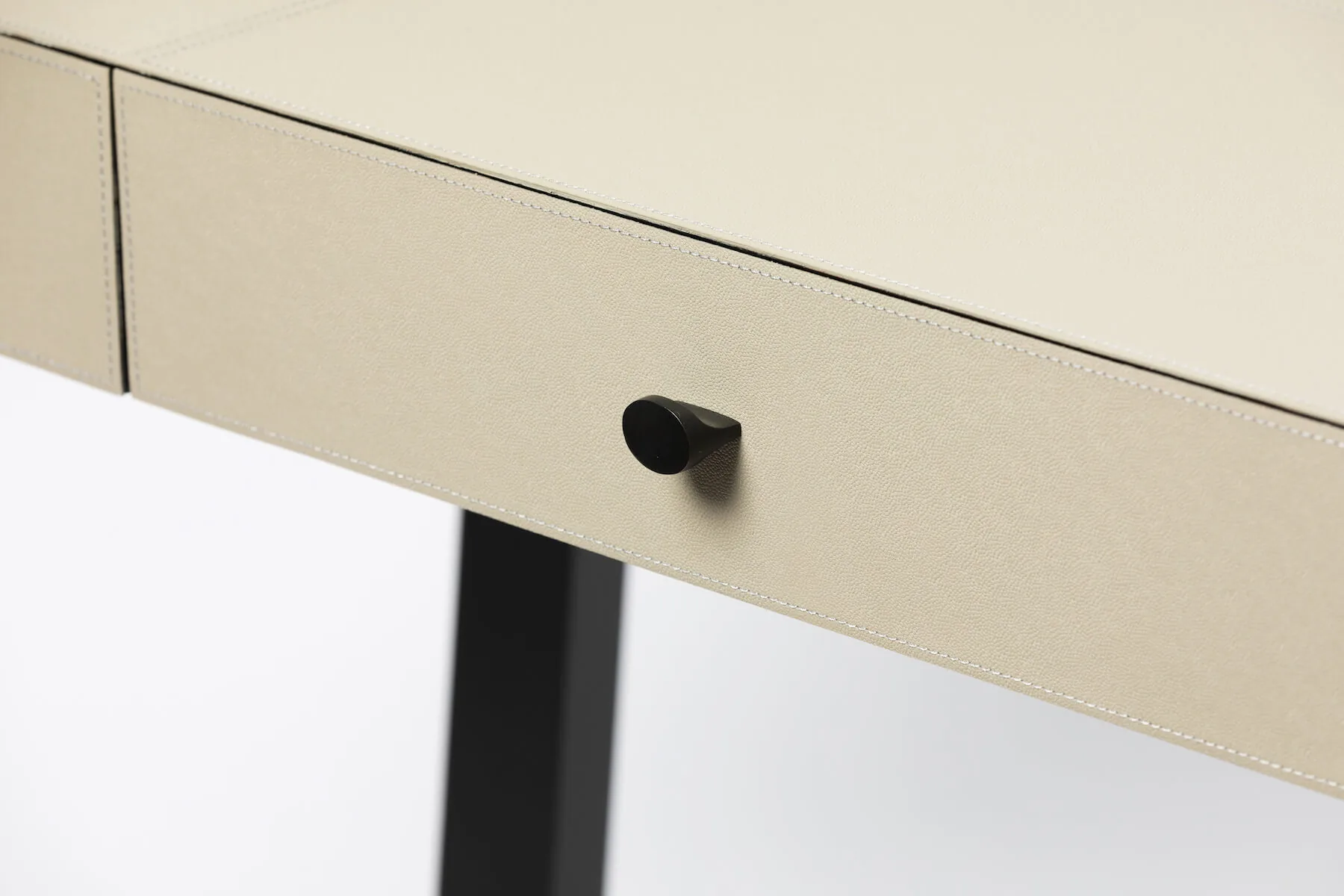 Slim Jim Desk French Grey Leather — The smooth French grey leather surface, hand-wrapped over a reinforced top, exudes…