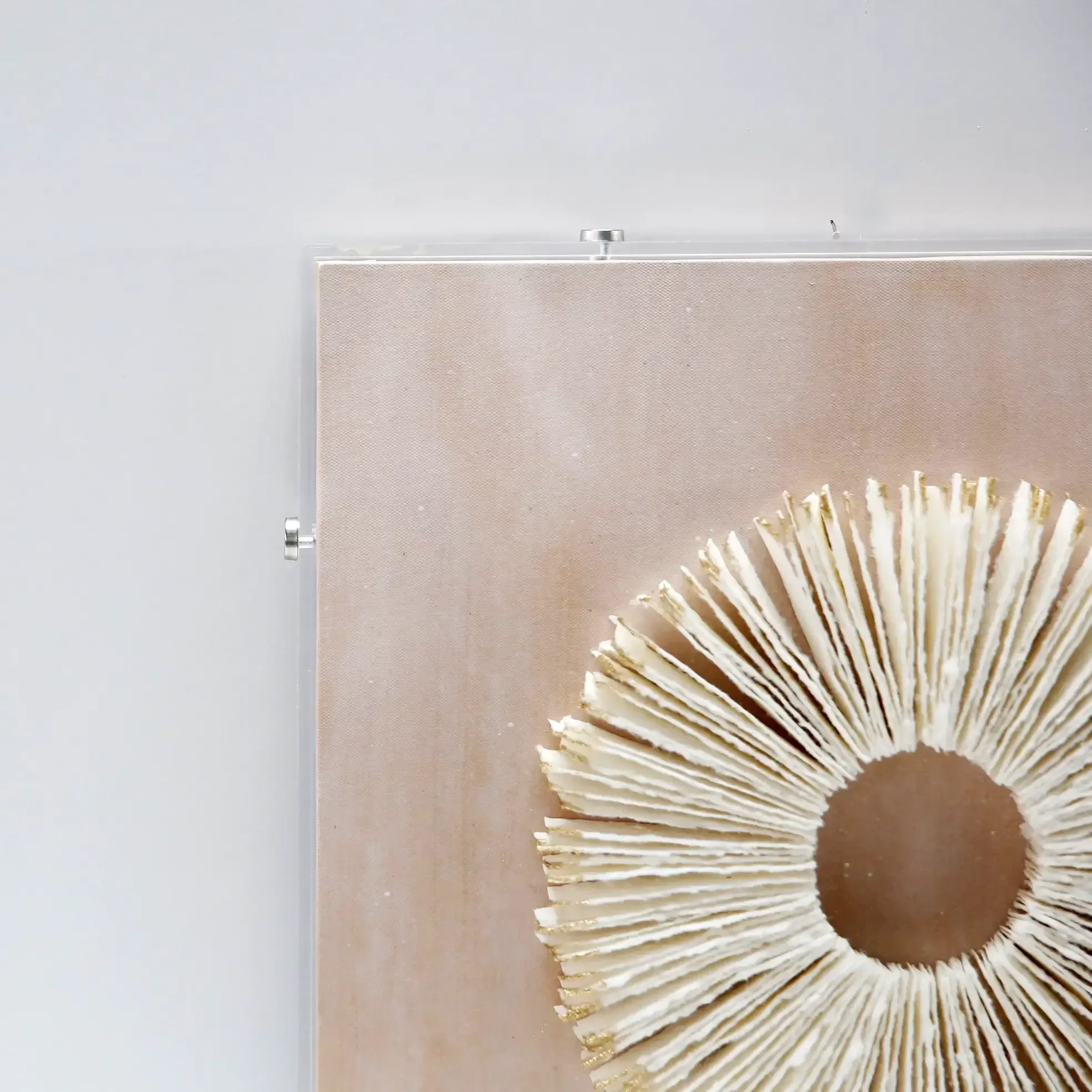 Sunwoven Handmade Dimensional Paper Wall Art — With its circular shape and radiating woven pattern, this artwork brings a…